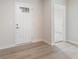 Bright entryway with light wood-look flooring, white trim, and a front door with a window insert at 140 Mission Terrace Dr, Whiteland, IN 46184