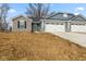 New construction home with blue siding, stone accents, and a two-car garage on a sunny day at 140 Mission Terrace Dr, Whiteland, IN 46184