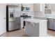 Kitchen featuring stainless steel appliances, an island and hardwood flooring at 140 Mission Terrace Dr, Whiteland, IN 46184