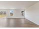Bright Living Room with sliding glass doors to deck and light hardwood floors at 140 Mission Terrace Dr, Whiteland, IN 46184