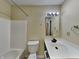 Bathroom featuring vanity, framed mirror, and shower and tub combo at 14457 Orange Blossom Trl, Fishers, IN 46038