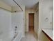 Bright bathroom with tiled shower and storage space at 14457 Orange Blossom Trl, Fishers, IN 46038