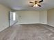 Large primary bedroom with ceiling fan, carpet and entry to a hallway at 14457 Orange Blossom Trl, Fishers, IN 46038