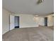 Open living room with stairs to second floor and open door to a closet at 14457 Orange Blossom Trl, Fishers, IN 46038