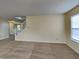 Comfortable living room with stairs to second floor and natural light from window at 14457 Orange Blossom Trl, Fishers, IN 46038
