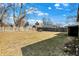Wide backyard view featuring a detached garage with a wooden fence at 1529 Bailey Dr, Indianapolis, IN 46241