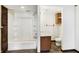 Bathroom with a shower, and wood vanity with sink at 1529 Bailey Dr, Indianapolis, IN 46241