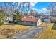 Charming home with a well-kept lawn, driveway, and mature trees at 1529 Bailey Dr, Indianapolis, IN 46241
