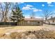 Charming single-story home with wood siding and a well-maintained front yard under a blue sky at 1529 Bailey Dr, Indianapolis, IN 46241