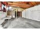 Spacious garage with exposed ceiling beams offering lots of potential at 1529 Bailey Dr, Indianapolis, IN 46241