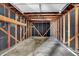 Unfinished garage with wooden frame and overhead door framework at 1529 Bailey Dr, Indianapolis, IN 46241