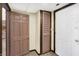 Basement hallway with access to storage and other rooms, featuring neutral carpeting at 1529 Bailey Dr, Indianapolis, IN 46241