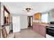 Bright kitchen with wood countertop, and appliances, adjacent to other rooms at 1529 Bailey Dr, Indianapolis, IN 46241