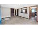 Comfortable living room featuring built-in shelving and views into the kitchen at 1529 Bailey Dr, Indianapolis, IN 46241