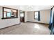 Open living room area with a view into the kitchen, featuring natural light and carpet at 1529 Bailey Dr, Indianapolis, IN 46241