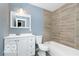 A modern bathroom features a vanity with drawers and a bathtub at 1807 Dayton Ave, Indianapolis, IN 46203