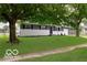 Well-maintained home with a beautiful lawn and mature trees offering great curb appeal at 1807 Dayton Ave, Indianapolis, IN 46203