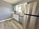 Updated kitchen featuring modern appliances and ample counter space with stylish cabinets at 1807 Dayton Ave, Indianapolis, IN 46203