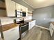 Well lit kitchen featuring stainless steel appliances, and plenty of cabinet space at 1807 Dayton Ave, Indianapolis, IN 46203