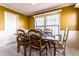 Dining area featuring wood table, seating for six, and bright natural light at 1962 Pamona Ct, Indianapolis, IN 46214