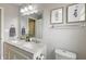 Bathroom featuring a double sink vanity, mirror, and matching decor at 23 Greenacre Dr, Brownsburg, IN 46112