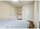 Neutral bedroom with a white dresser, plush bedding, and hardwood floors at 23 Greenacre Dr, Brownsburg, IN 46112
