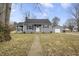 Charming single Gathering home with gray siding, black shutters, and a well-maintained front yard at 23 Greenacre Dr, Brownsburg, IN 46112
