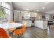 Eat-in kitchen with stainless steel appliances, stylish lighting, and lots of natural light at 23 Greenacre Dr, Brownsburg, IN 46112