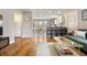 Open concept living room with hardwood floors, natural light, and seamless flow to the kitchen at 23 Greenacre Dr, Brownsburg, IN 46112