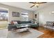 Comfortable living room featuring a large sectional sofa, hardwood floors, and stylish decor at 23 Greenacre Dr, Brownsburg, IN 46112