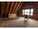 Attic space with two chairs at 3615 E State Rd 32, Lebanon, IN 46052