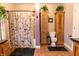 Bathroom with a shower, toilet, and a natural wood cabinet at 3615 E State Rd 32, Lebanon, IN 46052