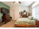 Bedroom with a queen sized bed, a TV, and a closet at 3615 E State Rd 32, Lebanon, IN 46052