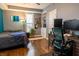 Well lit bedroom with hardwood floors, a queen sized bed, and a workstation at 3615 E State Rd 32, Lebanon, IN 46052