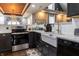 Well lit kitchen with stainless steel oven, granite counter tops, and white farmhouse sink at 3615 E State Rd 32, Lebanon, IN 46052