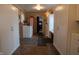 Laundry room with washer, cabinets for storage, tile floors, drying racks and bench seating at 3615 E State Rd 32, Lebanon, IN 46052