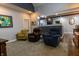 Cozy living room with comfortable chairs, neutral walls, and open access to the kitchen enhancing the living space at 3615 E State Rd 32, Lebanon, IN 46052