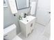 This bathroom features light gray walls, a white vanity, and black fixtures at 3723 N Olney St, Indianapolis, IN 46218