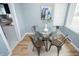 Cozy dining area featuring a glass table, modern decor, and access to the kitchen at 3723 N Olney St, Indianapolis, IN 46218