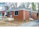 Quaint brick home showcasing a well-maintained exterior and a neatly landscaped yard at 3723 N Olney St, Indianapolis, IN 46218