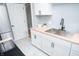 Bright kitchen features stainless steel appliances, wood countertops, white cabinets, and stainless sink at 3723 N Olney St, Indianapolis, IN 46218