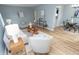 Bright living room features modern furniture, neutral tones, and wood flooring at 3723 N Olney St, Indianapolis, IN 46218