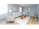 Stylish living room showcasing light-colored furniture, a wooden coffee table, and bright walls at 3723 N Olney St, Indianapolis, IN 46218