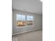 Bedroom featuring plush carpeting and view of neighborhood through double windows at 4160 Douro Trl, Westfield, IN 46062