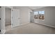 Bright bedroom featuring neutral carpeting, fresh paint, and white trim, with a view to the hall at 4160 Douro Trl, Westfield, IN 46062