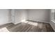 Neutral bedroom featuring wood floors, baseboards, and a bright window at 4160 Douro Trl, Westfield, IN 46062