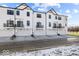 Townhome garages line the street, offering convenient parking and stylish curb appeal at 4160 Douro Trl, Westfield, IN 46062