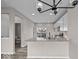 Updated kitchen with stainless appliances, quartz counters, and a view to the bathroom at 4160 Douro Trl, Westfield, IN 46062