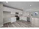 Well-lit kitchen with stainless steel appliances, white cabinets, and spacious layout at 4160 Douro Trl, Westfield, IN 46062