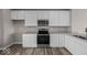 New kitchen featuring stainless steel appliances, white cabinets, and gray countertops at 4160 Douro Trl, Westfield, IN 46062
